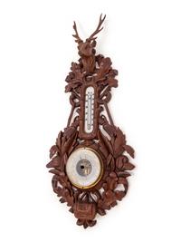 A Black Forest Carved Barometer and Thermometer