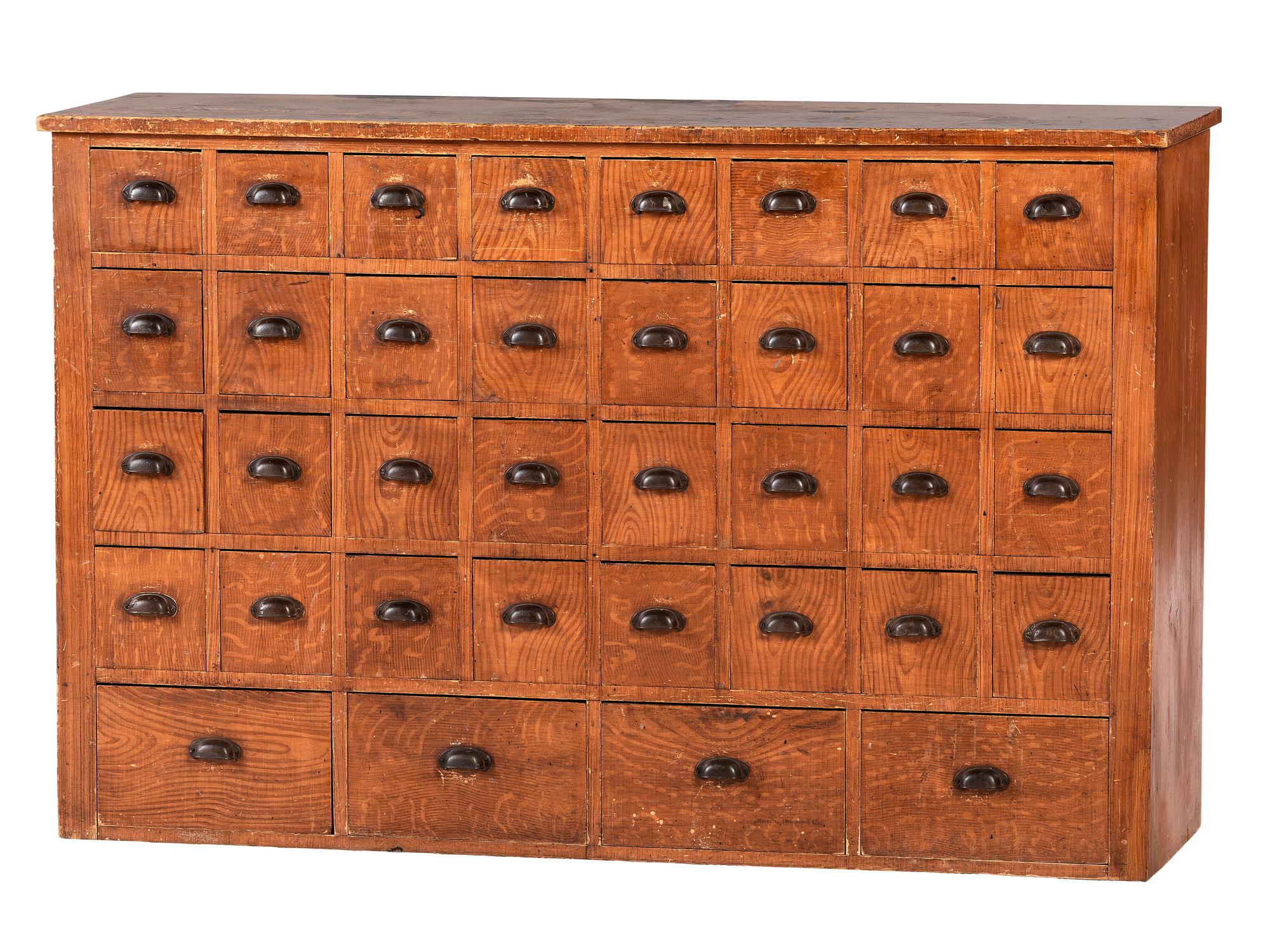 A Grain Painted Pine 36-Drawer Chest