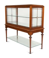 A Regency Style Mahogany Glazed Display Cabinet on Stand
