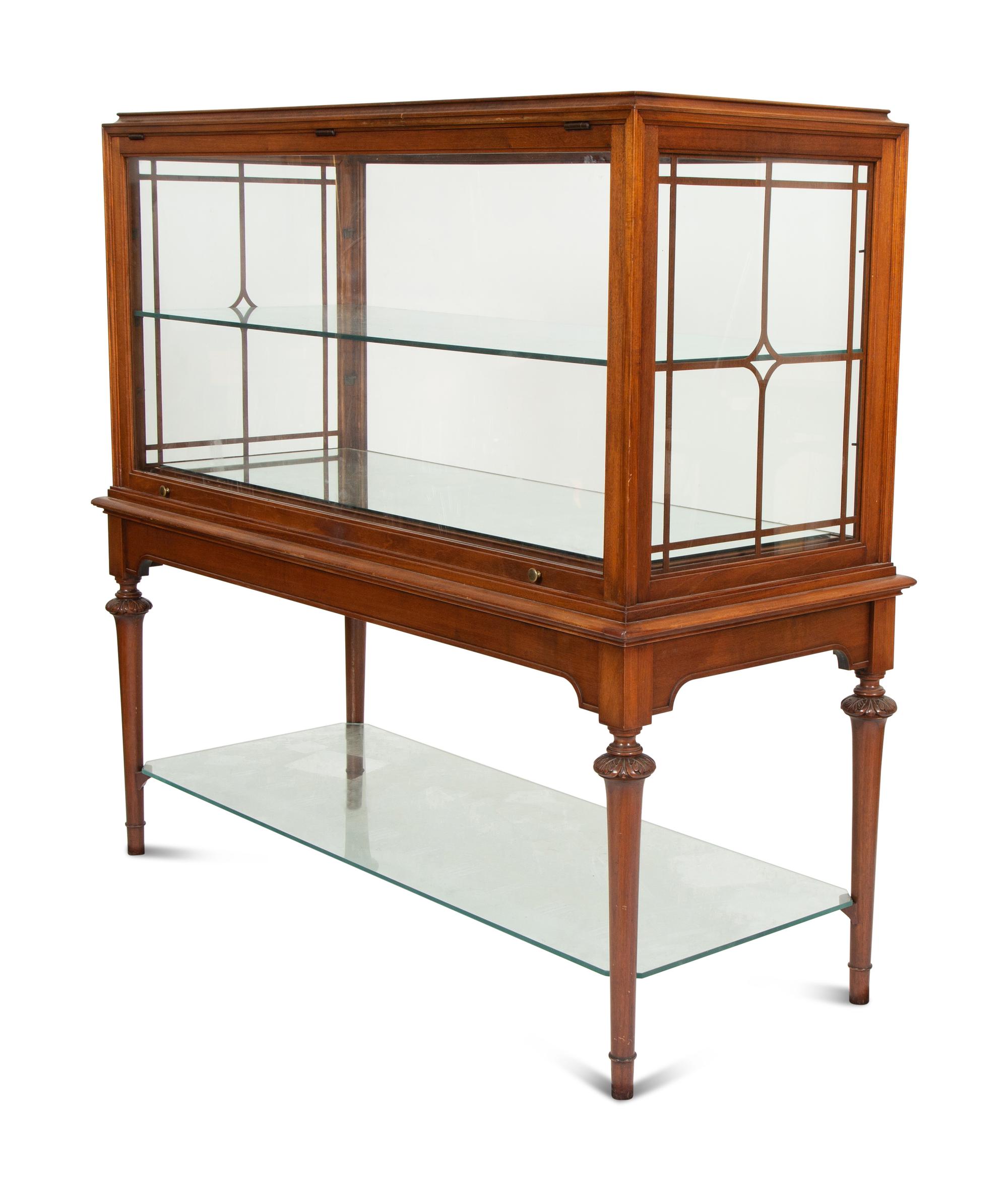 A Regency Style Mahogany Glazed Display Cabinet on Stand