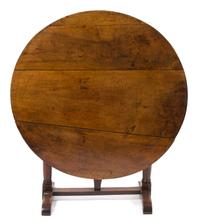 A Continental Provincial Style Walnut Tilt-Top Table Height 28 1/2 x diameter 42 inches. — 19TH CENTURY