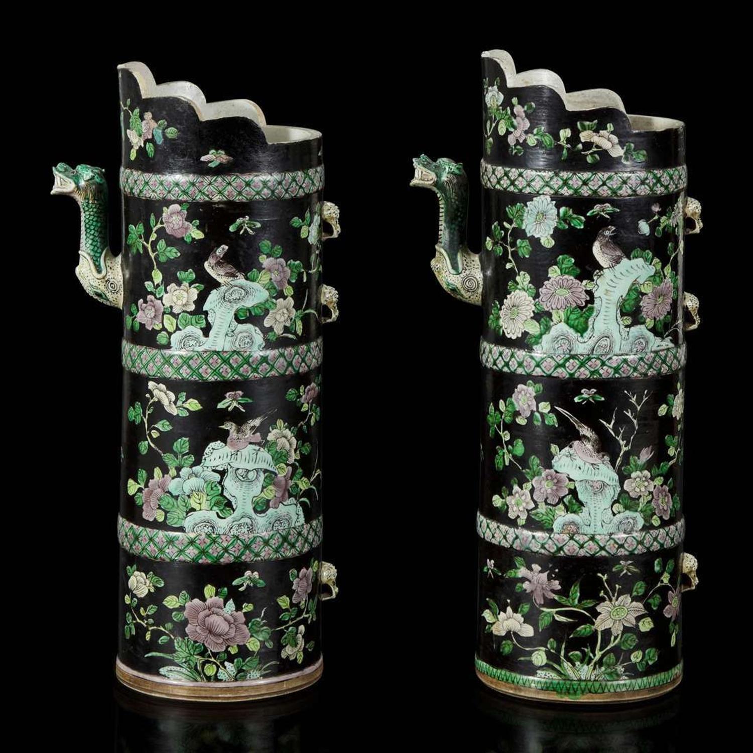 An associated pair of Chinese famille noir-decorated porcelain ceremonial ewers 黑地瓷胎画珐琅多穆壶两只 或为一对 Qing dynasty ?