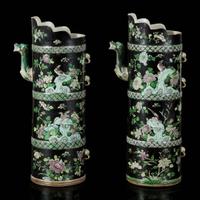 An associated pair of Chinese famille noir-decorated porcelain ceremonial ewers 黑地瓷胎画珐琅多穆壶两只 或为一对 Qing dynasty ?