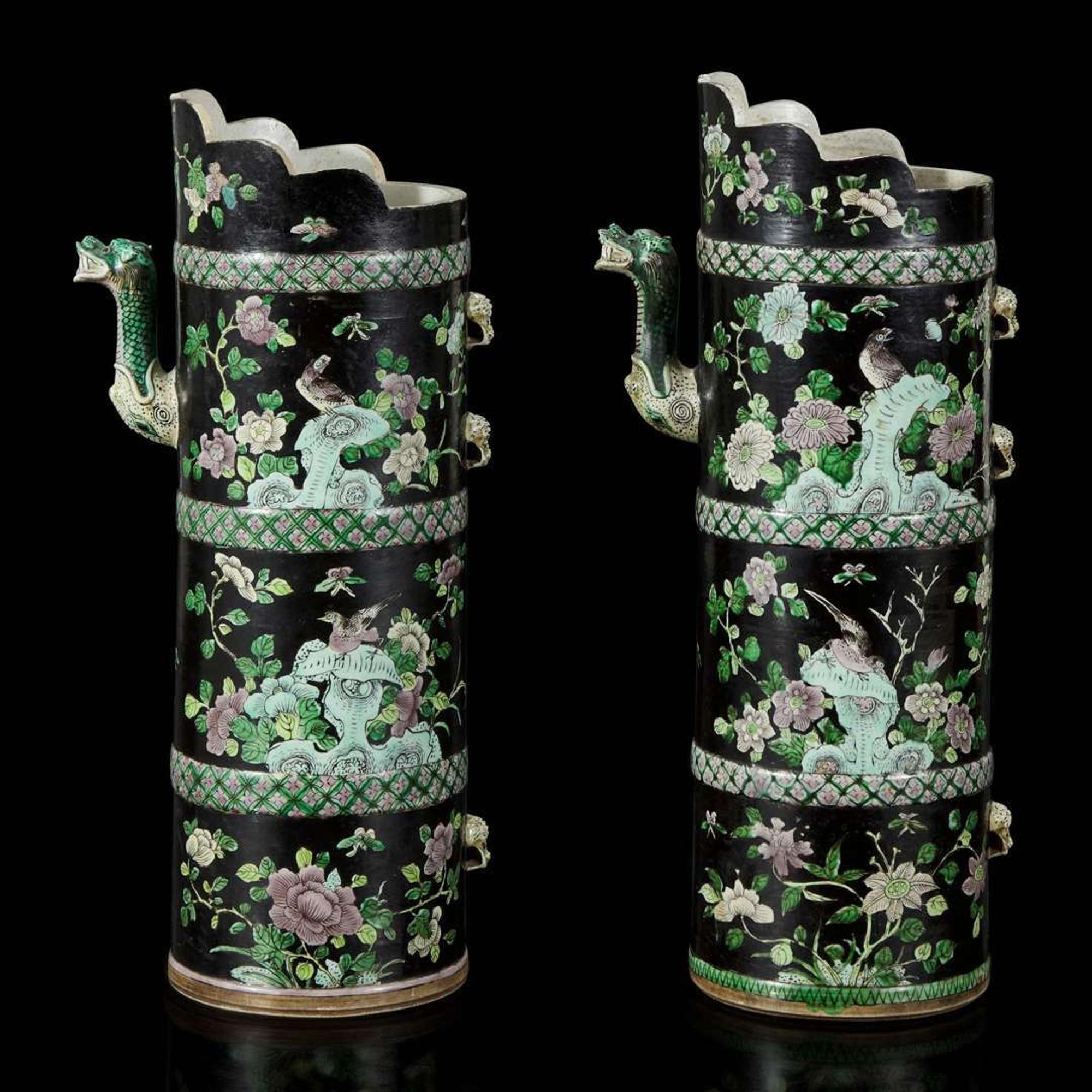 An associated pair of Chinese famille noir-decorated porcelain ceremonial ewers 黑地瓷胎画珐琅多穆壶两只 或为一对 Qing dynasty ?