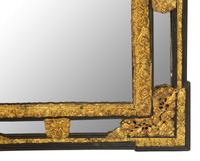 A Régence Style Pressed Brass Mirror