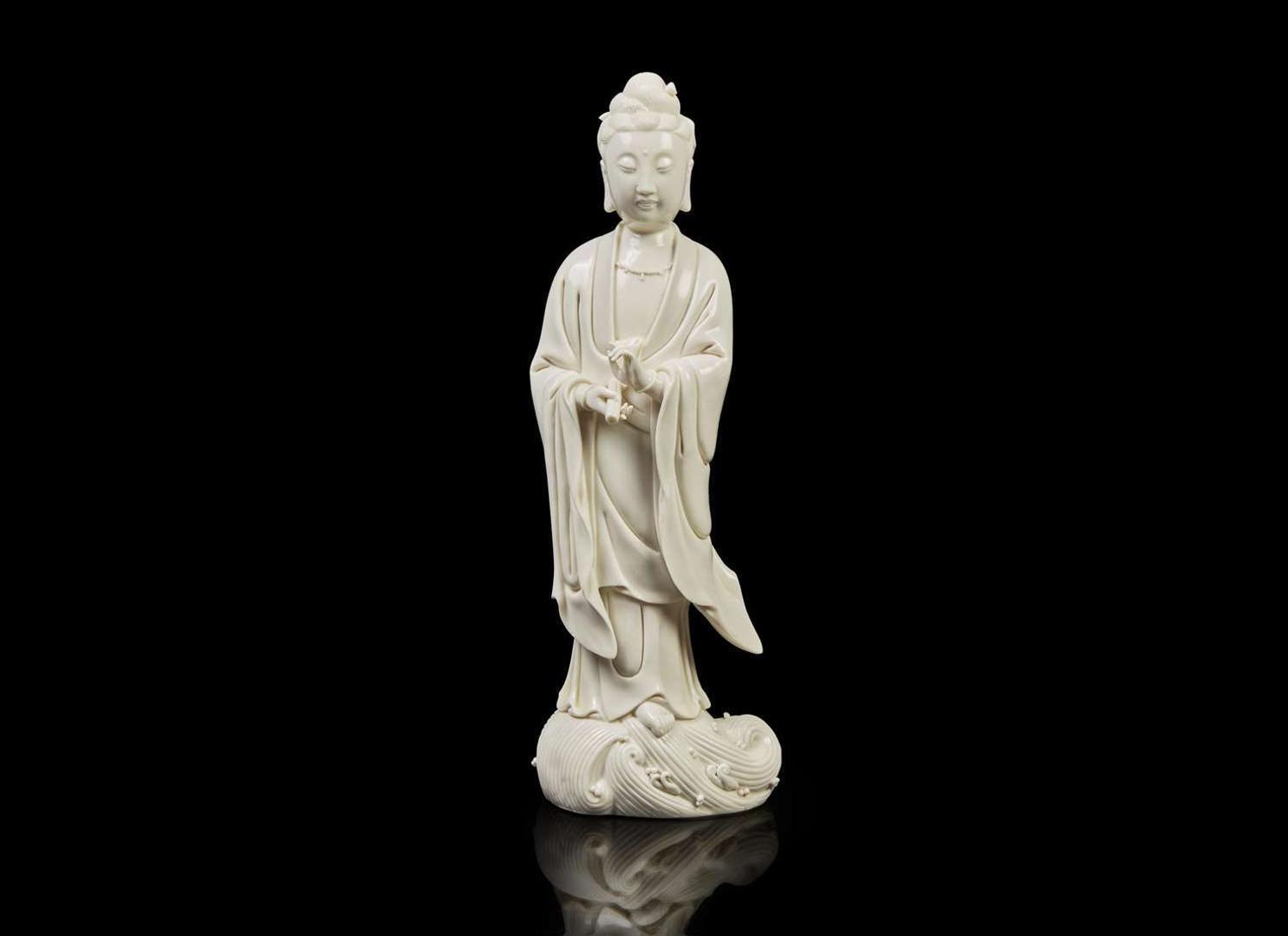 A Chinese Dehua blanc de Chine figure of Guanyin, Boji Yuren impressed mark 德化瓷觀音 博及漁人款