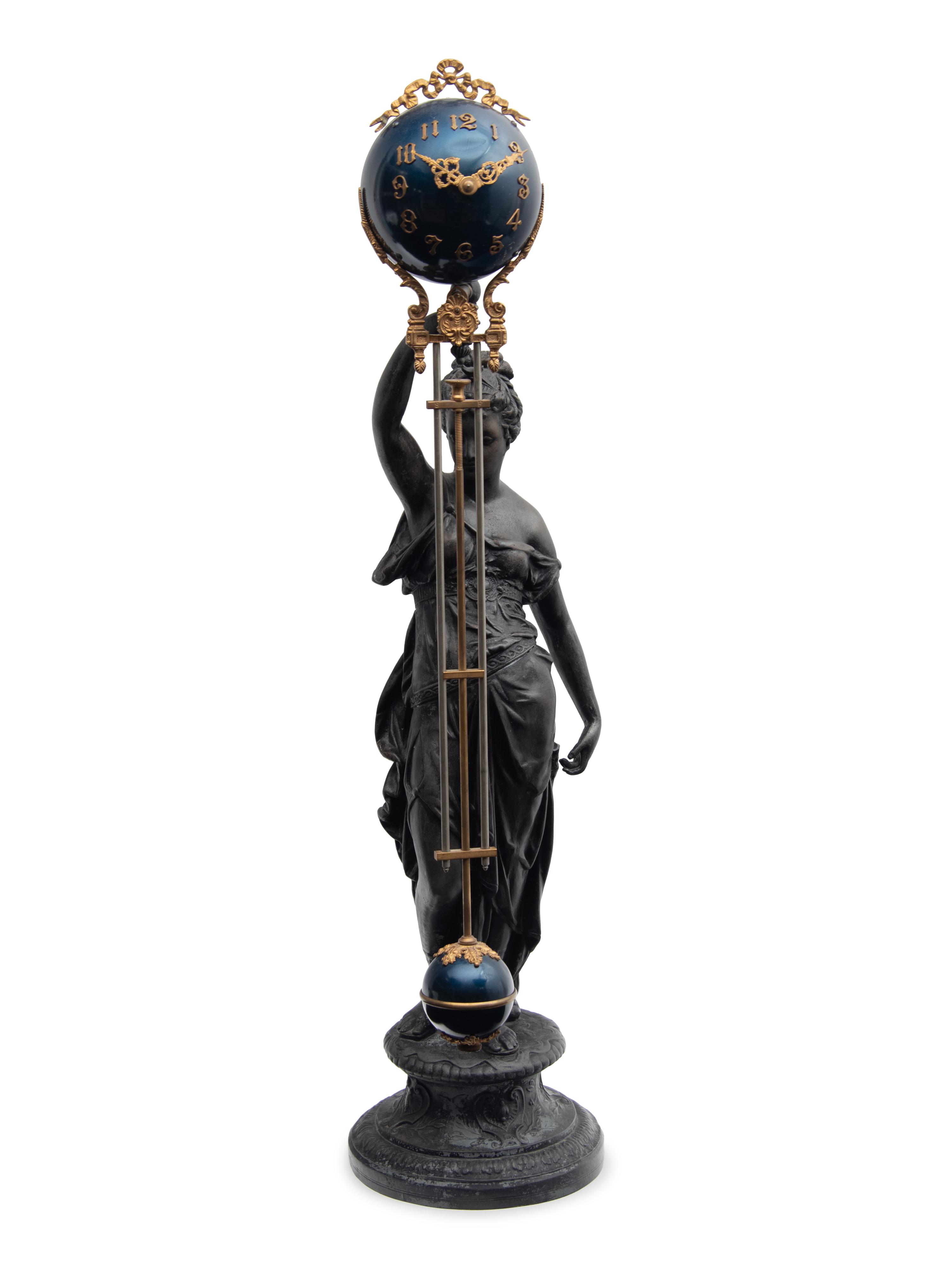 A Continental Cast Metal and Enameled Figural Pendulum Clock
