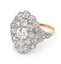 An Edwardian Platinum Topped Gold and Diamond Ring, 4.50 dwts.