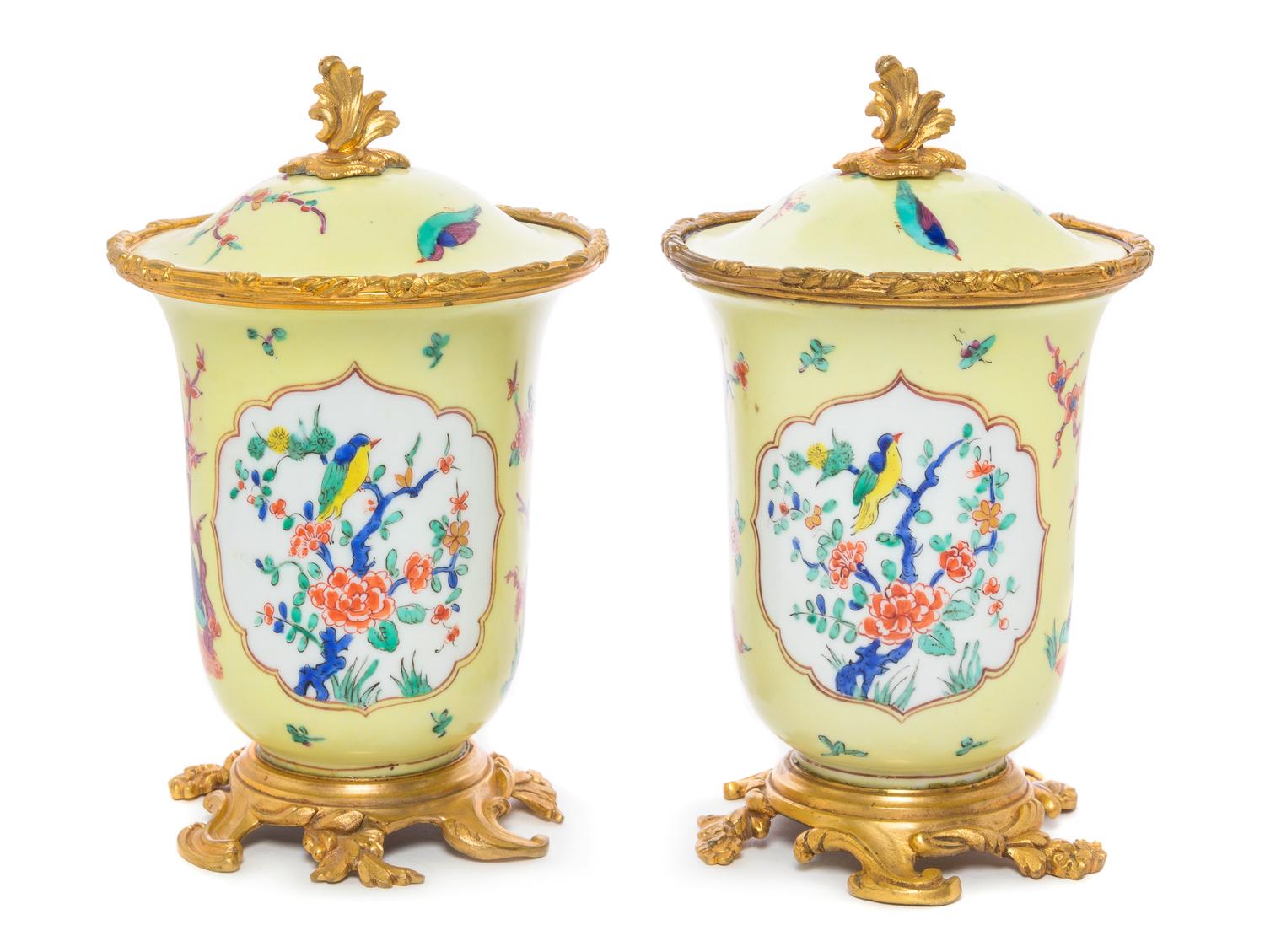 A Pair of French Gilt Bronze Mounted Porcelain Covered Jars Height 8 inches.
