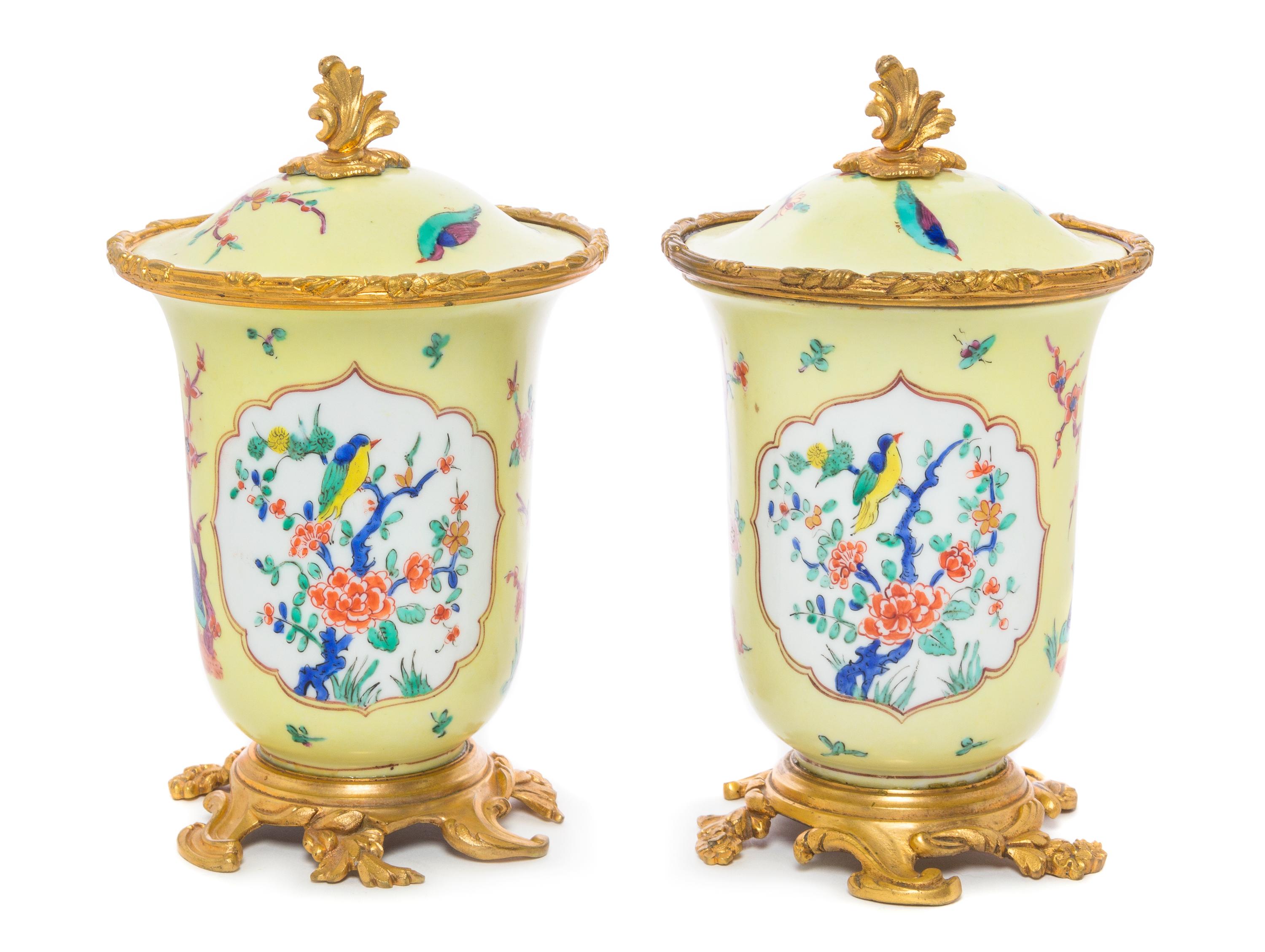 A Pair of French Gilt Bronze Mounted Porcelain Covered Jars Height 8 inches.