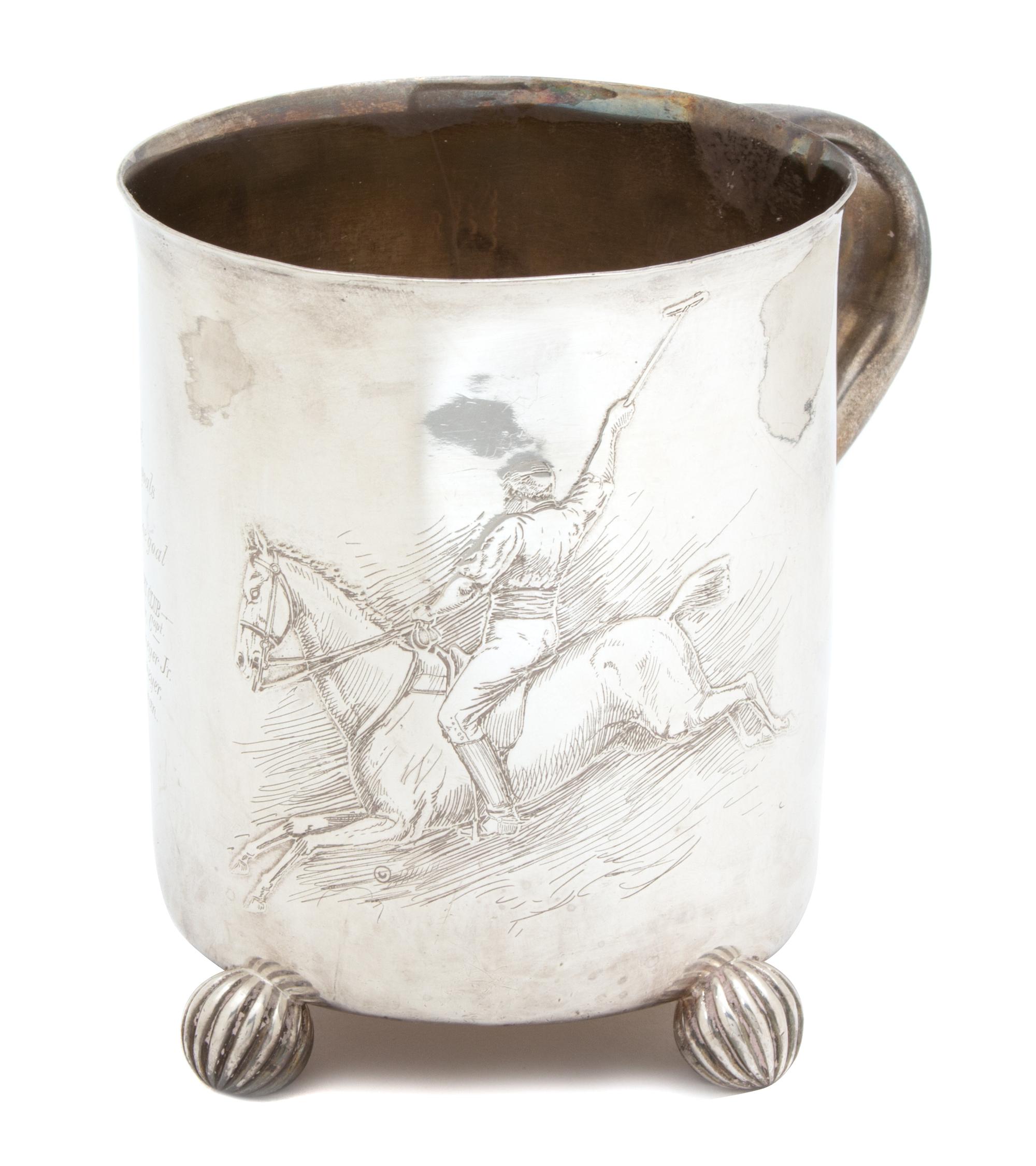An American Silver Trophy Cup, Theodore B. Starr, New York, NY, having one handle and raised on four fluted ball feet, having an engrav
