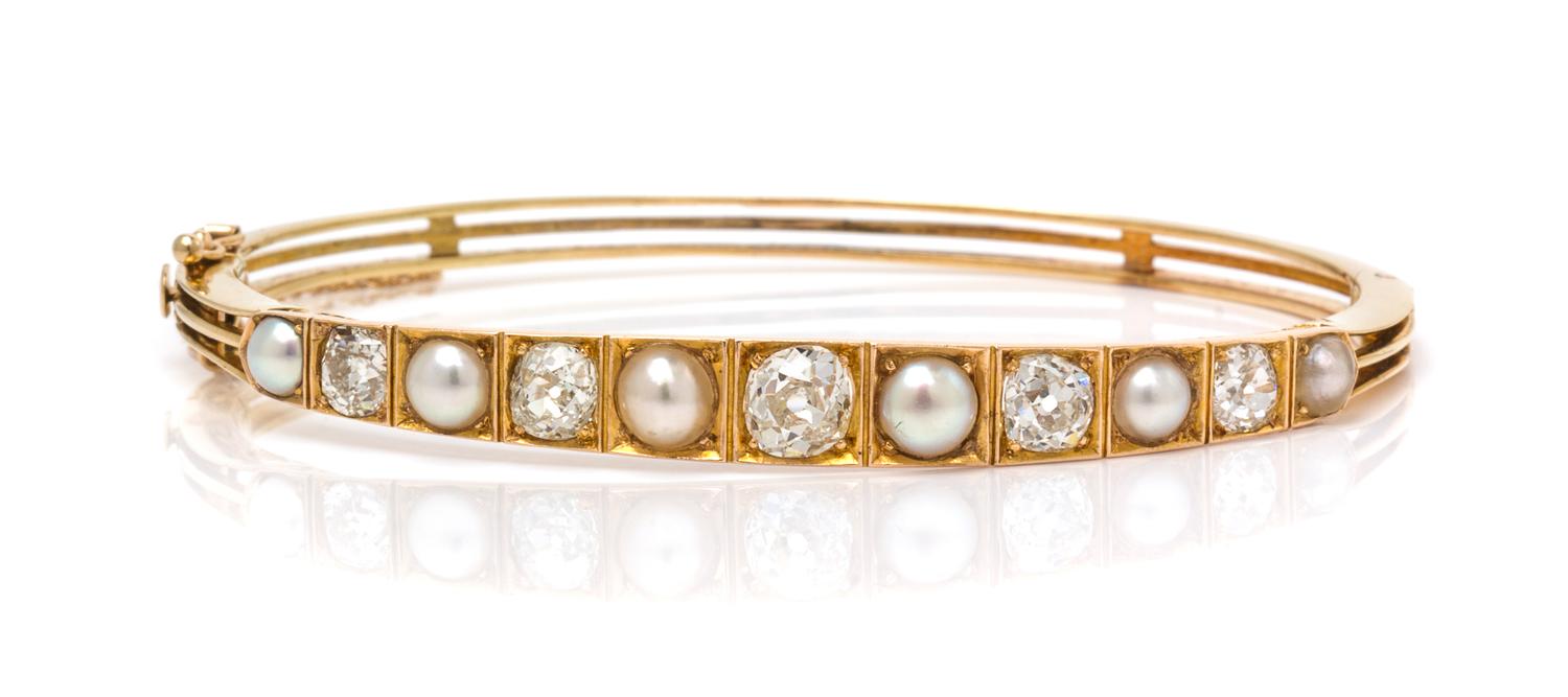 A Yellow Gold, Diamond and Pearl Bangle Bracelet, 9.30 dwts.