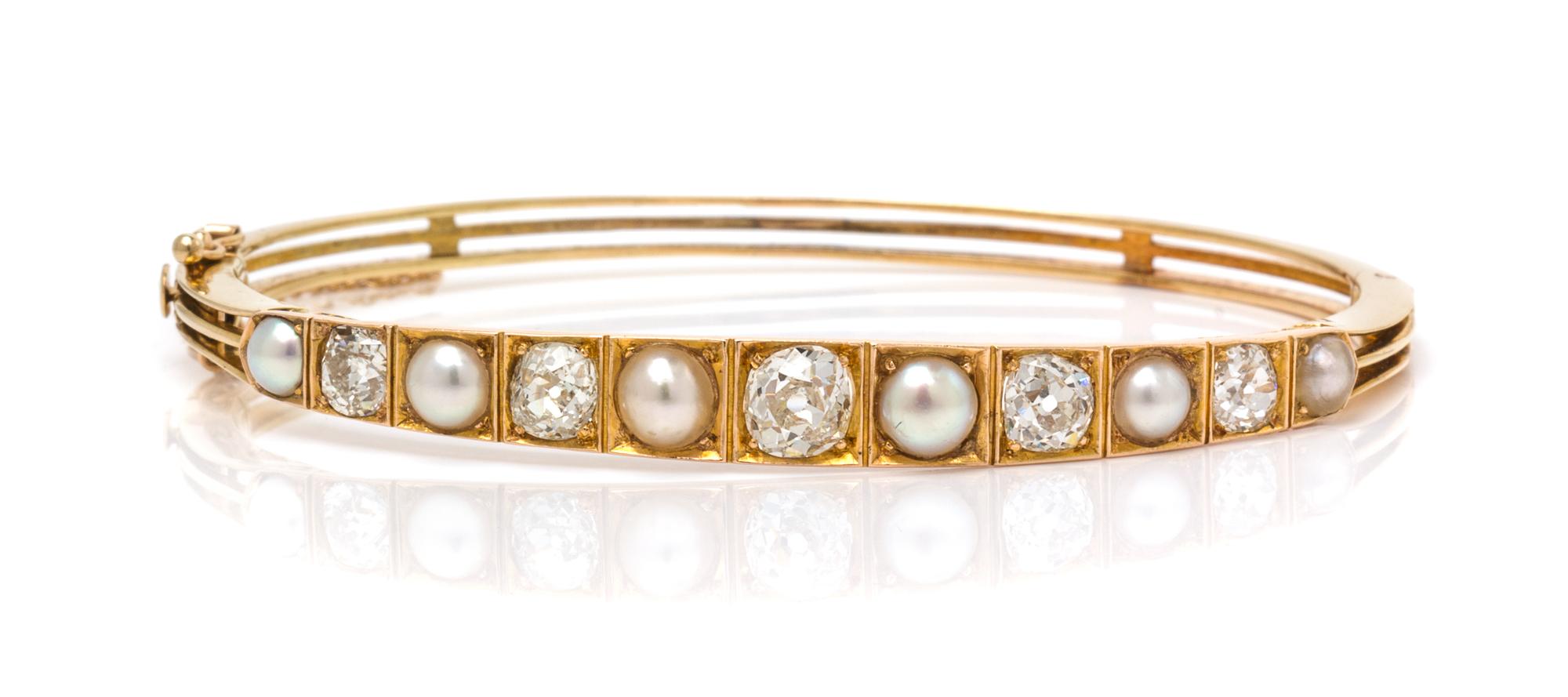 A Yellow Gold, Diamond and Pearl Bangle Bracelet, 9.30 dwts.