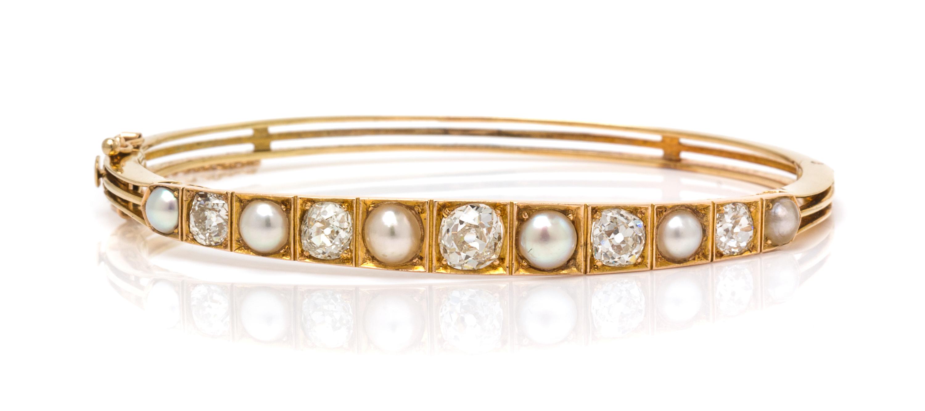 A Yellow Gold, Diamond and Pearl Bangle Bracelet, 9.30 dwts.