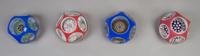 A Collection of Four Cased Glass Paperweights, Diameter 3 1/2 inches.
