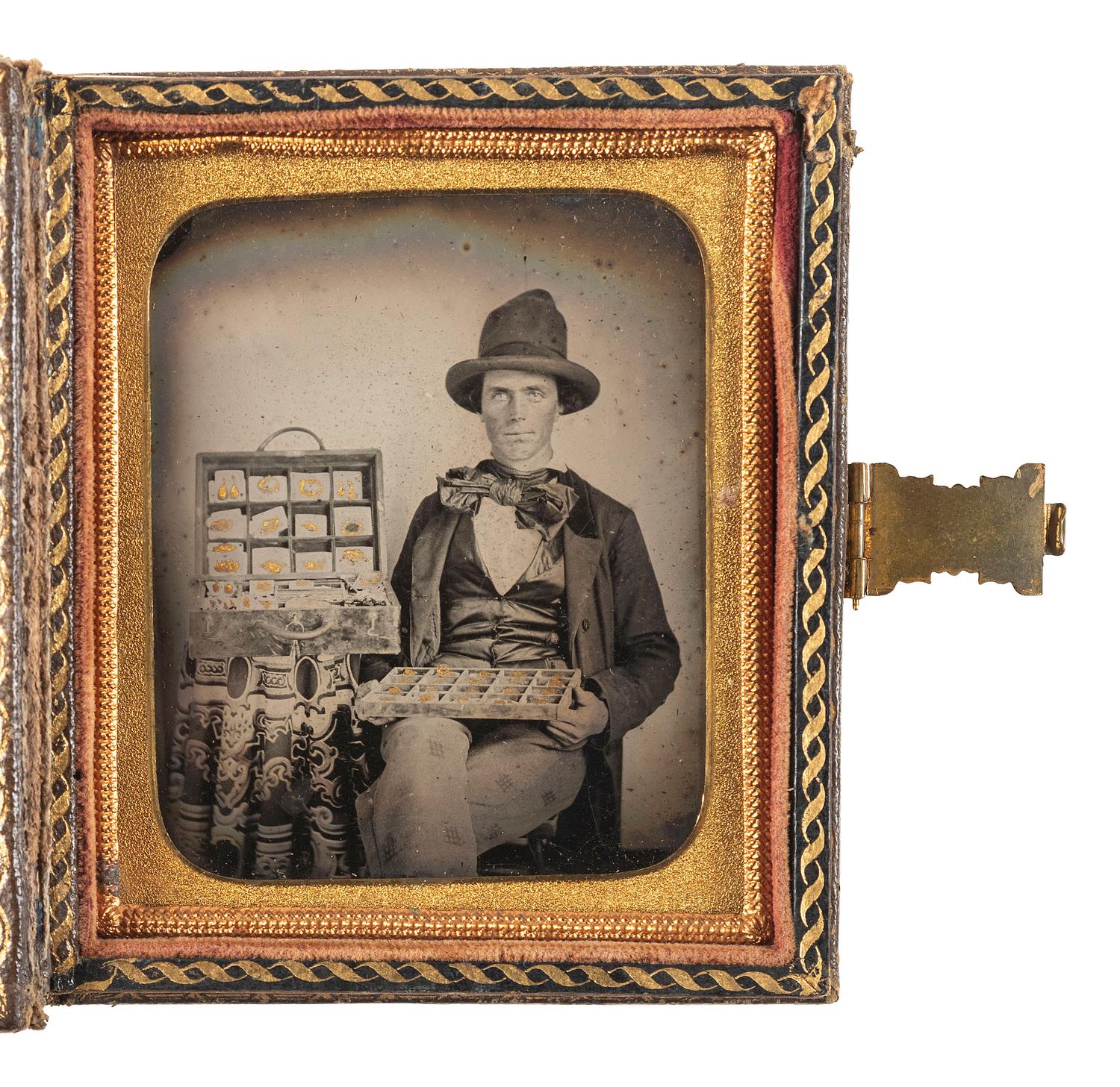 [EARLY PHOTOGRAPHY]. Sixth plate ambrotype featuring a jewelry salesman displaying his wares.