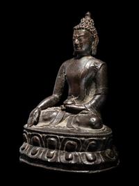 A Tibetan Bronze Figure of Seated Buddha Akshobhya