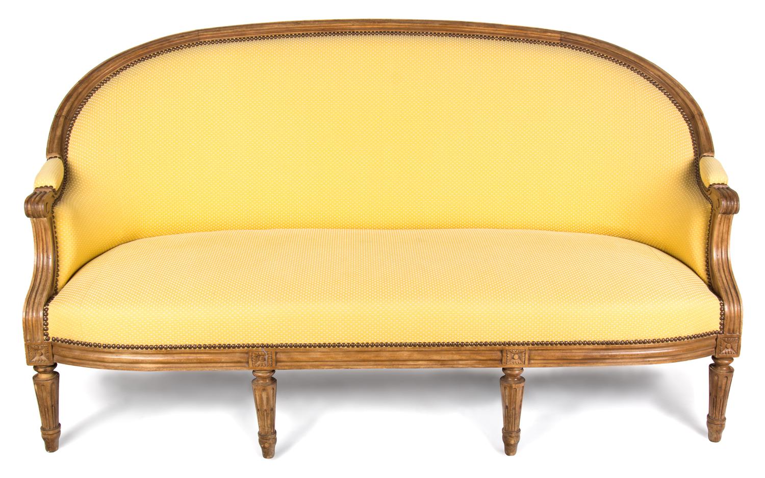 A Louis XVI Style Carved Walnut Canape Height 35 x width 69 x depth 32 inches. — LATE 18TH/EARLY 19TH CENTURY