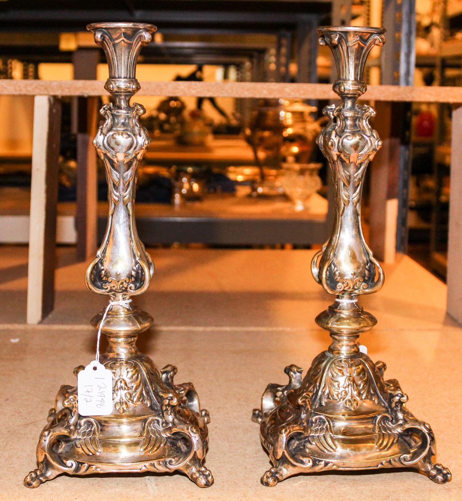 A Pair of Continental Silver-Plate Candlesticks. Height 14 1/4 inches.