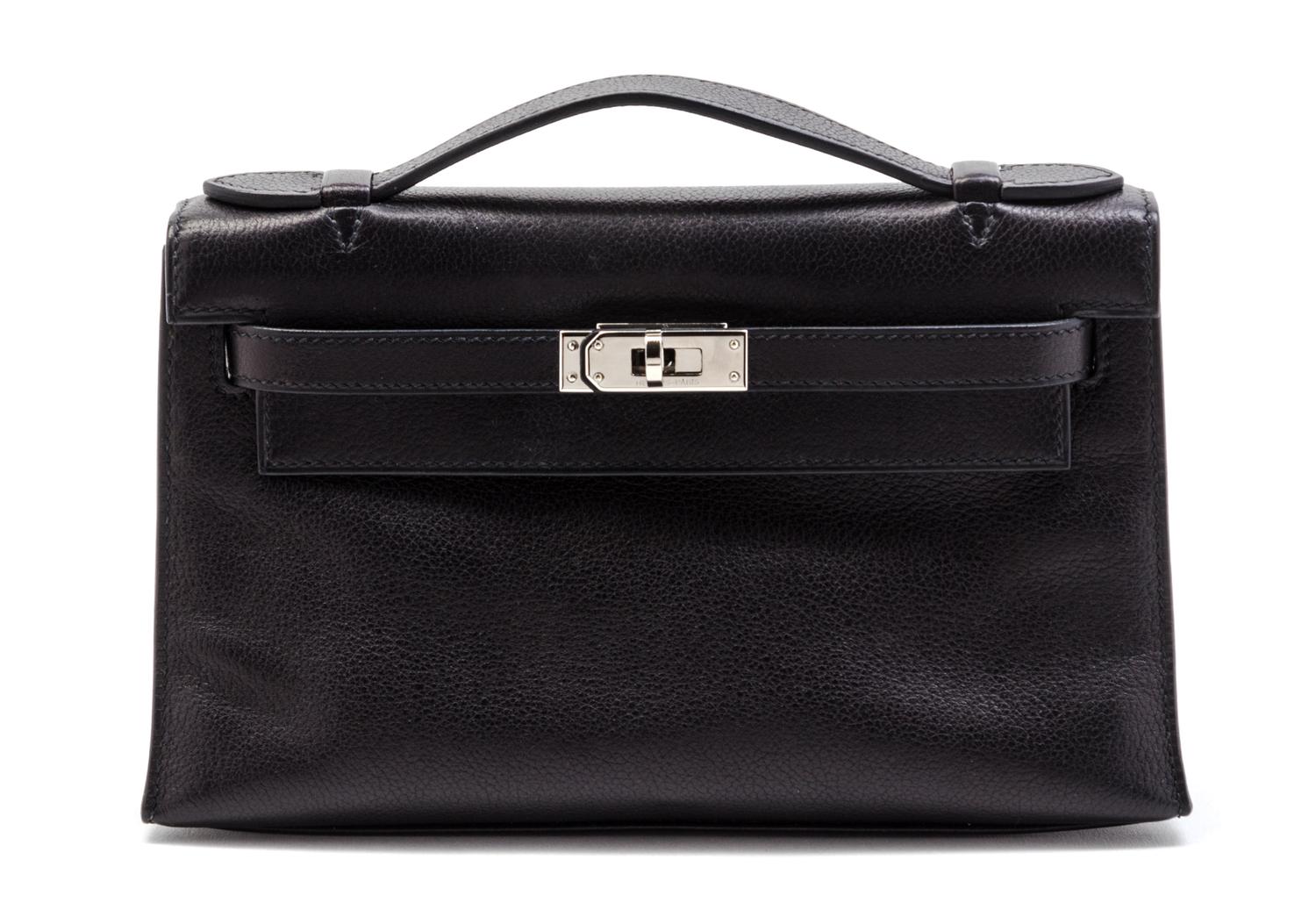 An Hermes Black Leather Kelly Clutch Pochette, 8 1/2 x 5 x 2 1/2 inches.
