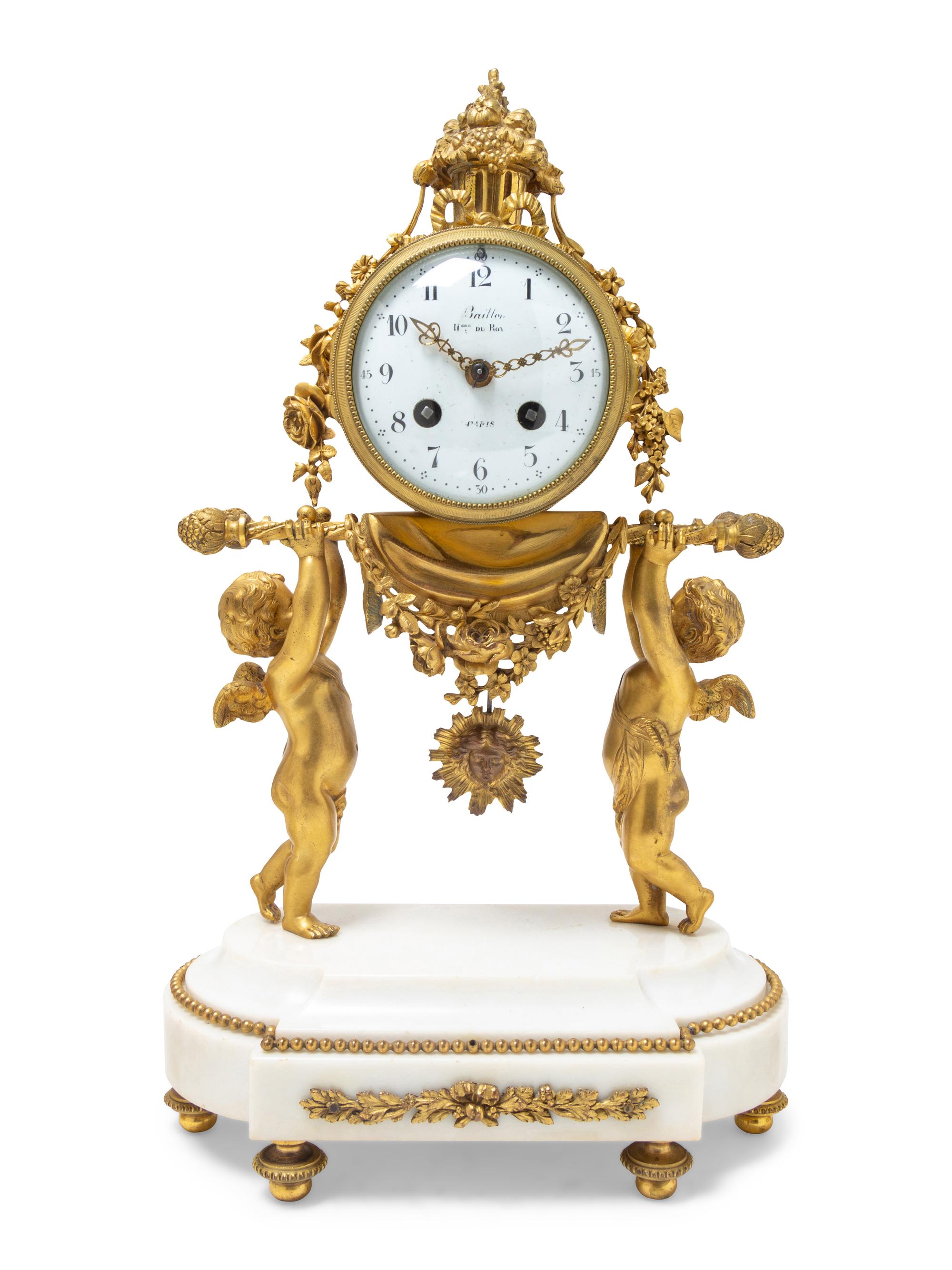 A Louis XVI Gilt Bronze and Marble Three-Piece Clock Garniture