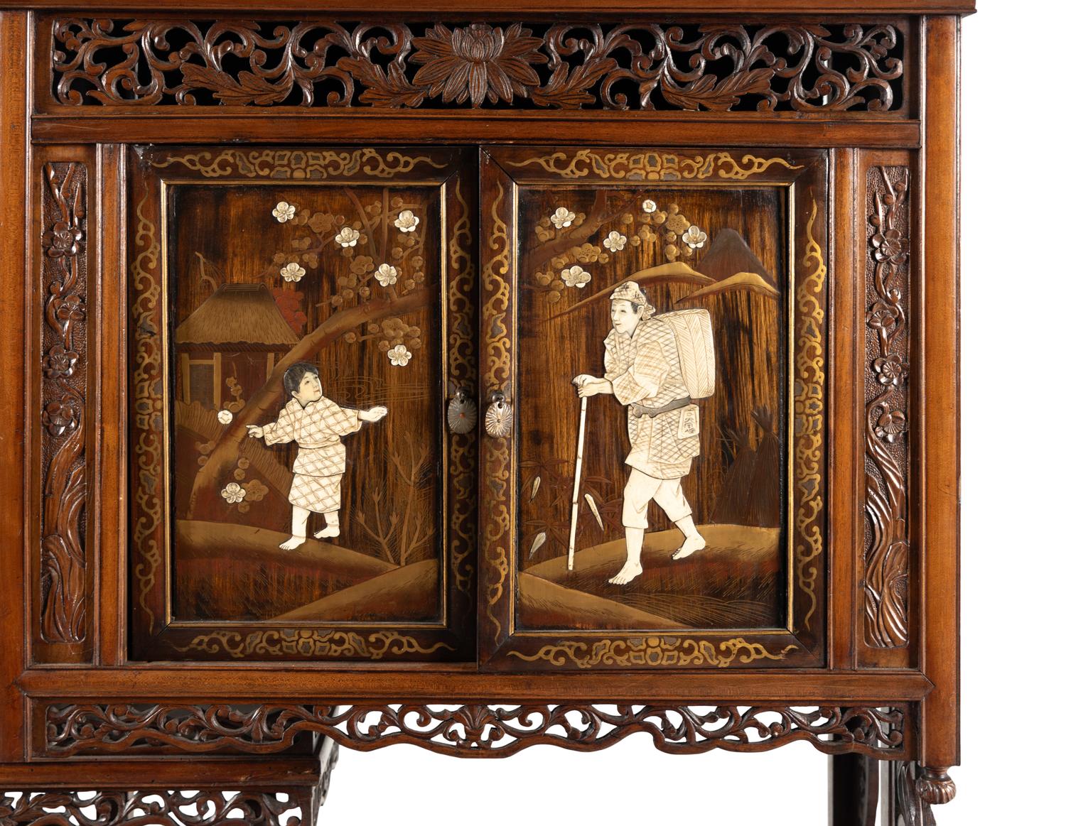 A Victorian Japonesque Carved and Inlaid Cabinet
