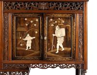 A Victorian Japonesque Carved and Inlaid Cabinet