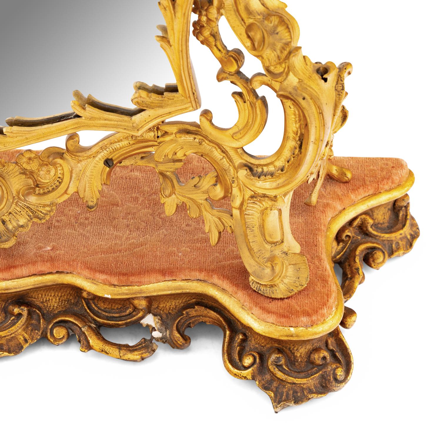 A Rococo Revival Gilt Bronze and Giltwood Dressing Mirror