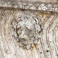 A Neoclassical Carved Marble Sarcophagus