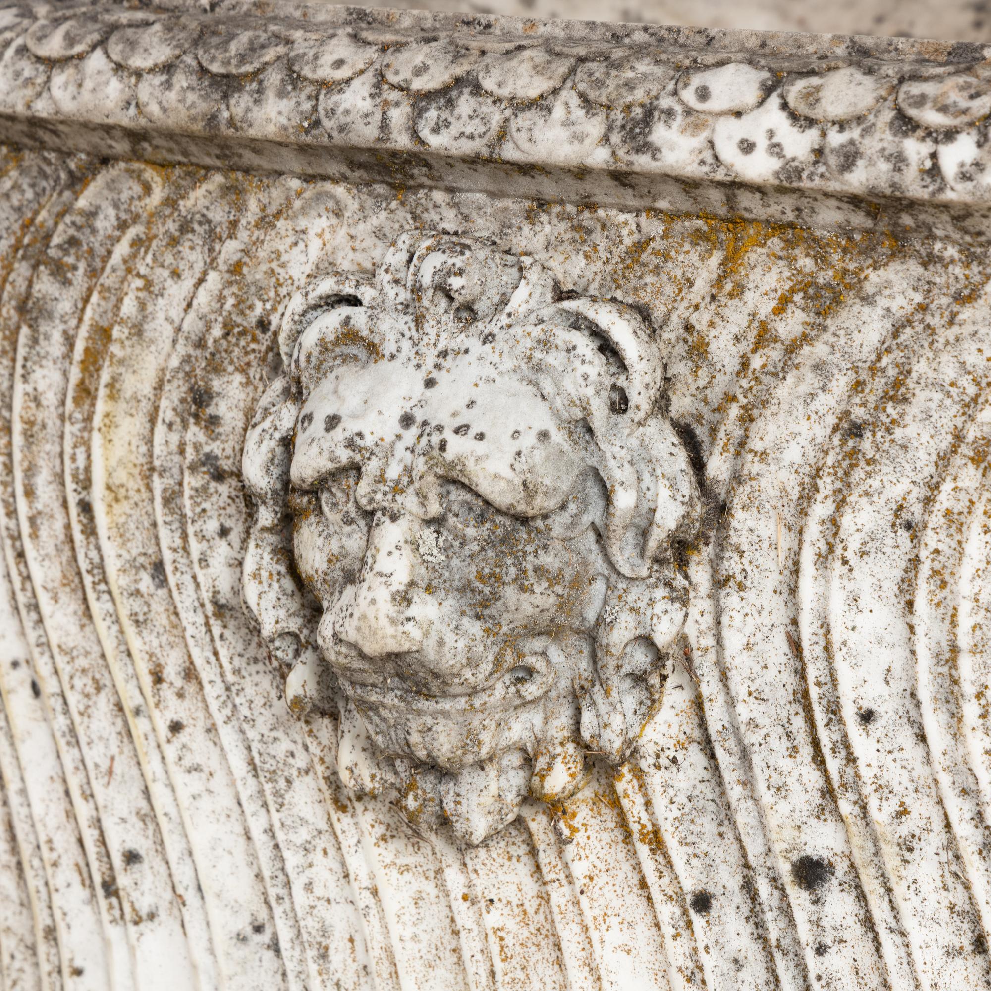 A Neoclassical Carved Marble Sarcophagus