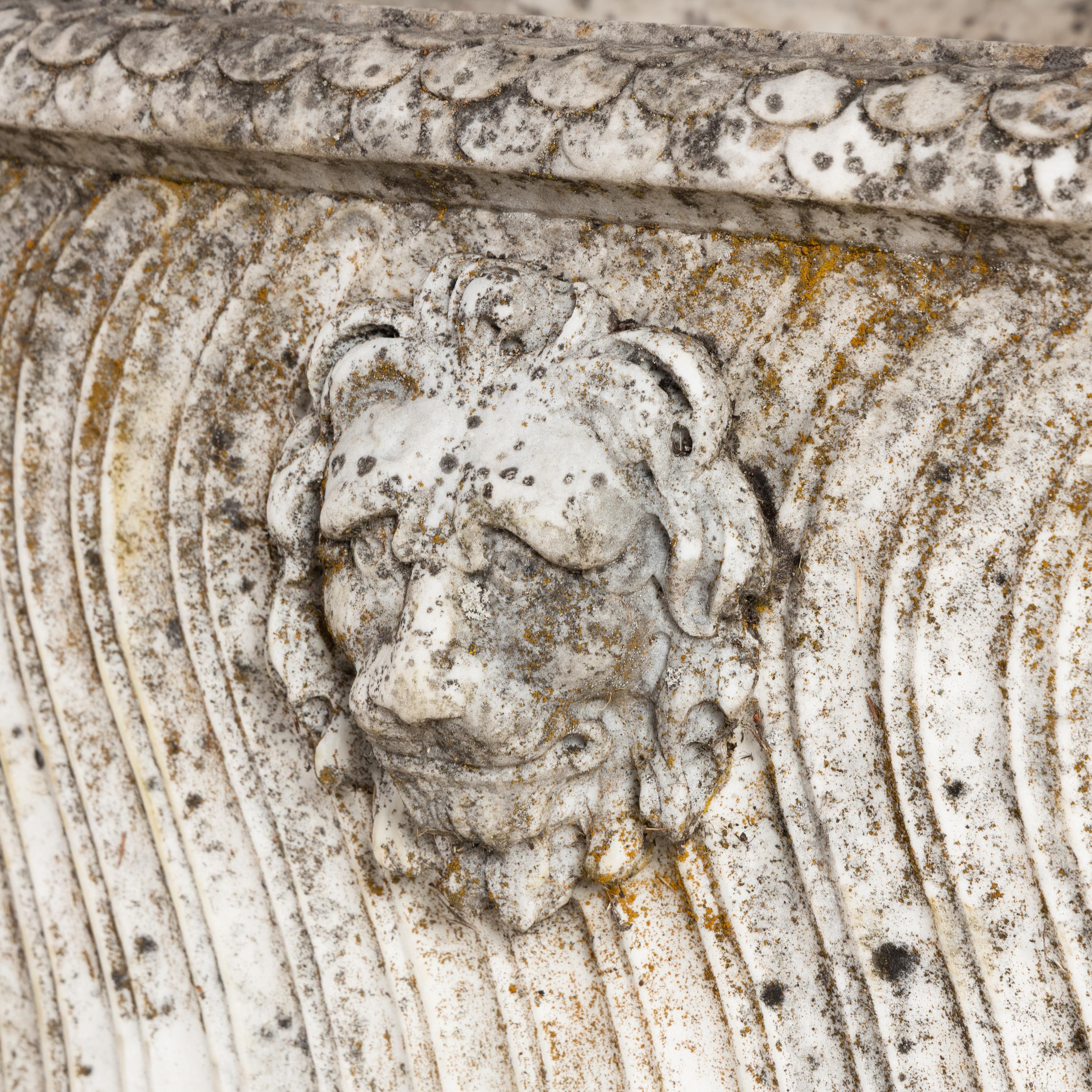A Neoclassical Carved Marble Sarcophagus
