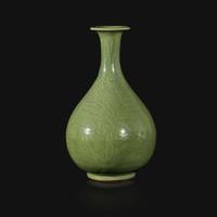An incised celadon-glazed bottle vase, Yuhuchunping