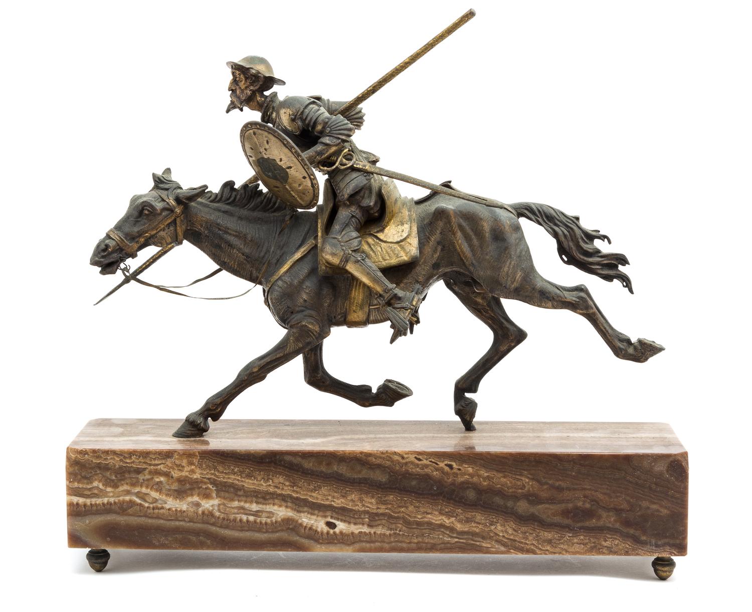 A Continental Gilt and Patinated Bronze Figural Group Height overall 16 1/2 x width of base 19 1/2 inches.