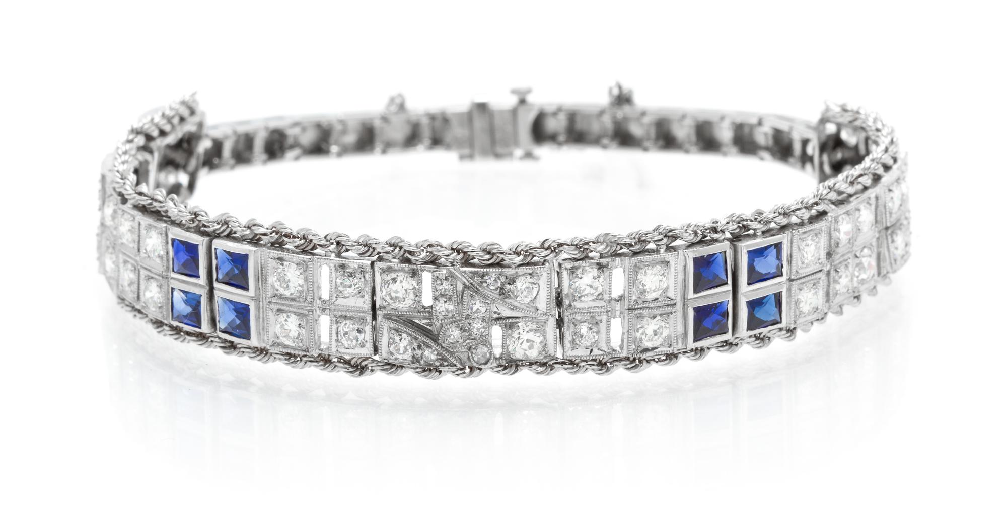 A Platinum, White Gold, Diamond and Synthetic Sapphire Bracelet, 21.30 dwts.