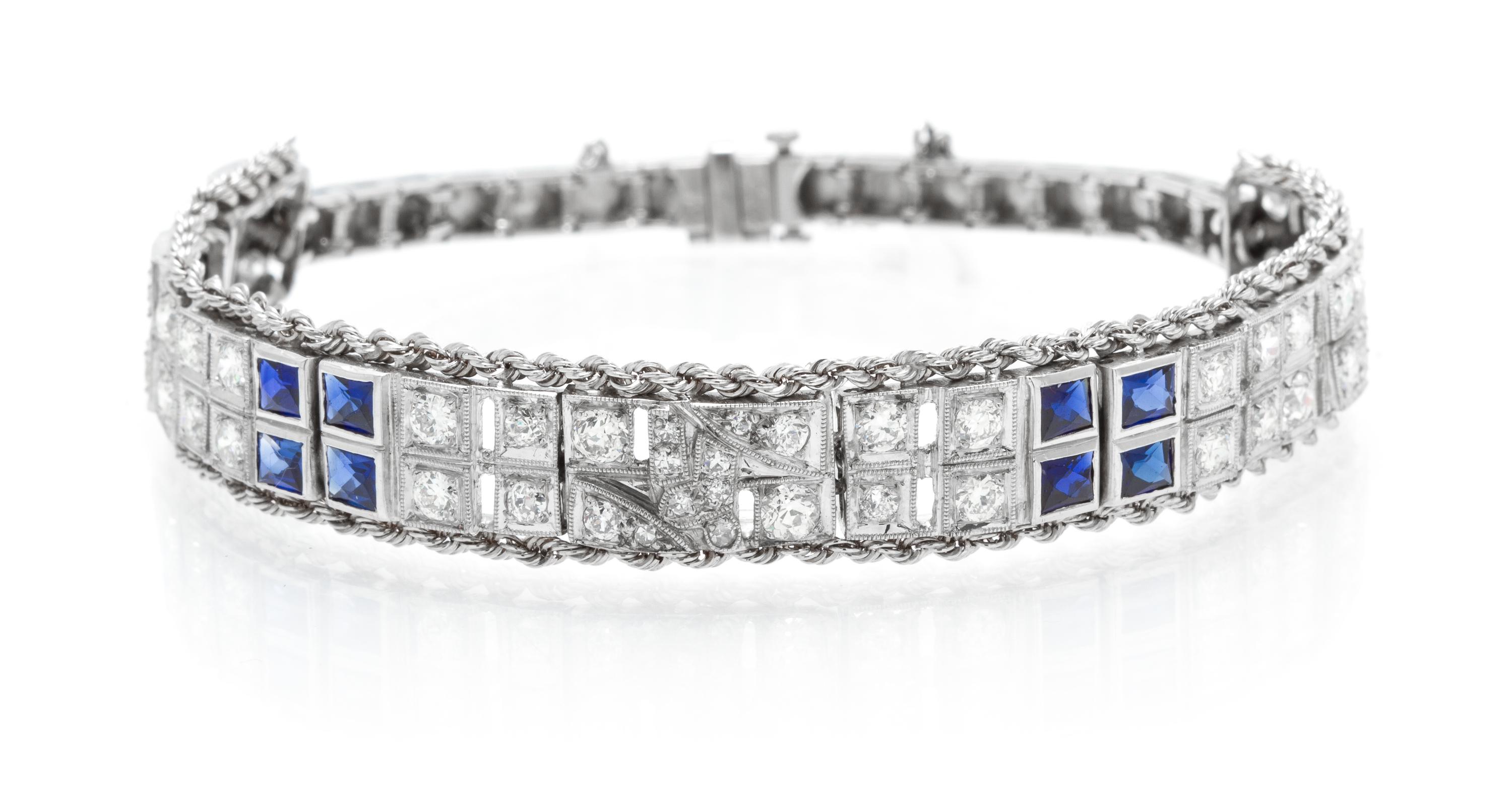 A Platinum, White Gold, Diamond and Synthetic Sapphire Bracelet, 21.30 dwts.