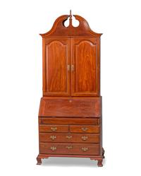 A Chippendale Figured Mahogany Bonnet Top Desk-and-Bookcase