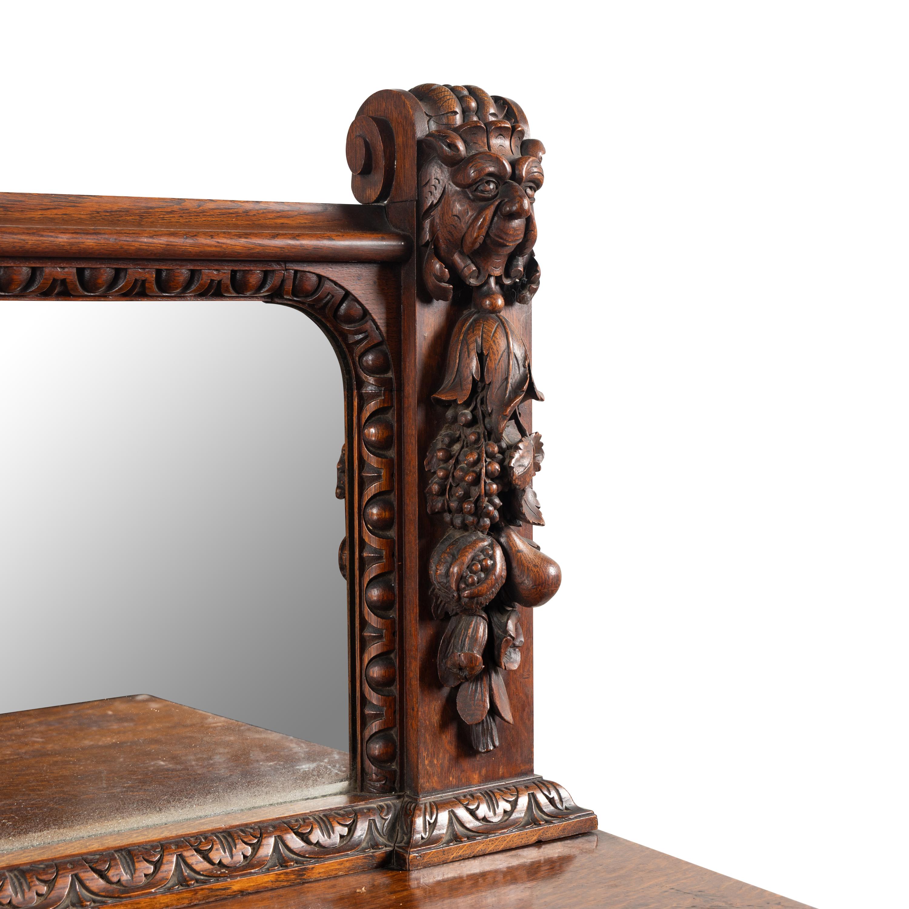 An English Renaissance Revival Carved Oak Serving Table