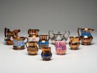 Twenty Lusterware Pitchers and Creamers
