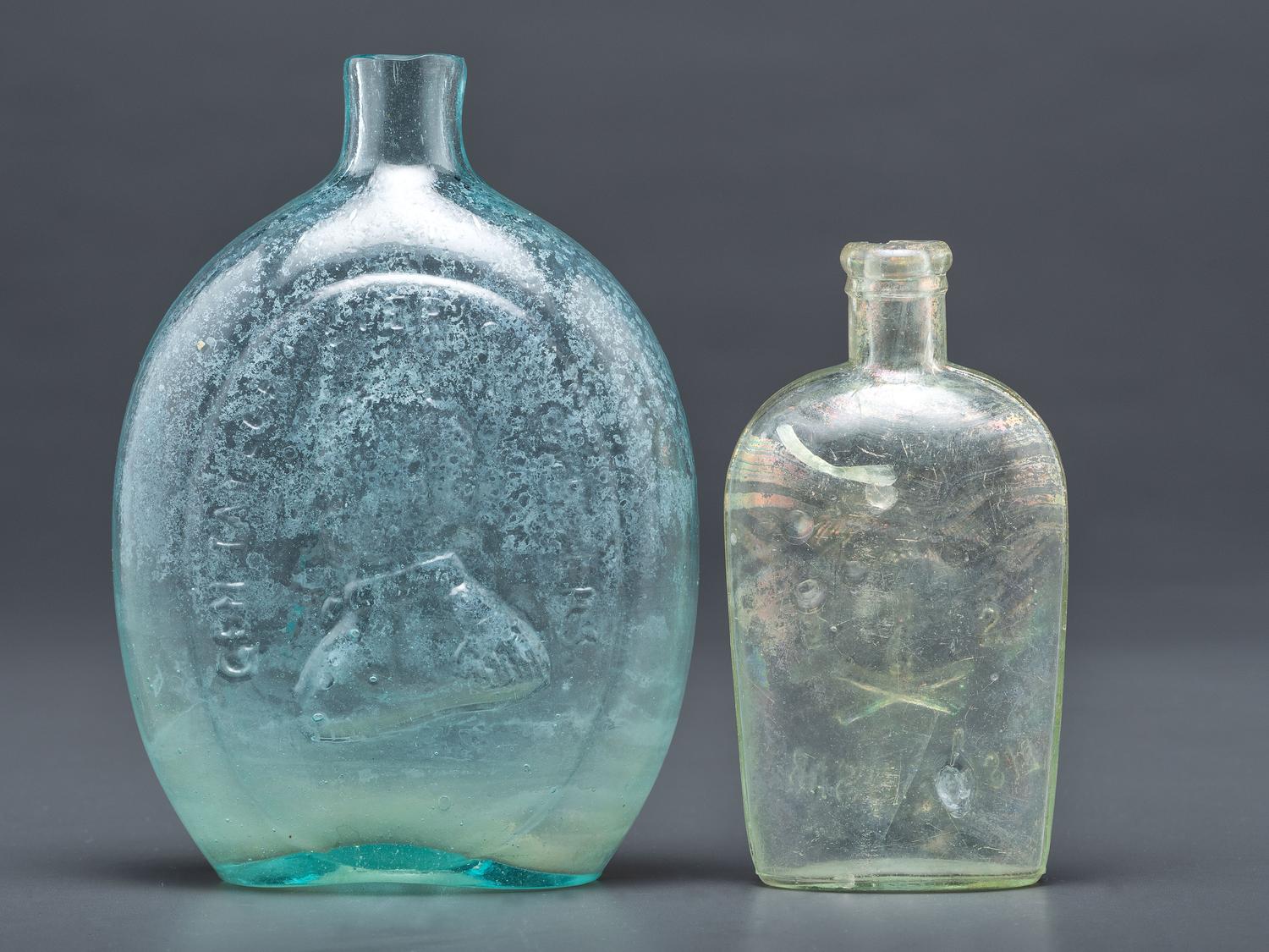 A Washington-Taylor Portrait Flask and South Carolina Dispensary Flask