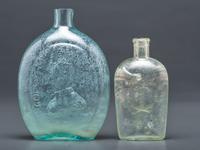A Washington-Taylor Portrait Flask and South Carolina Dispensary Flask