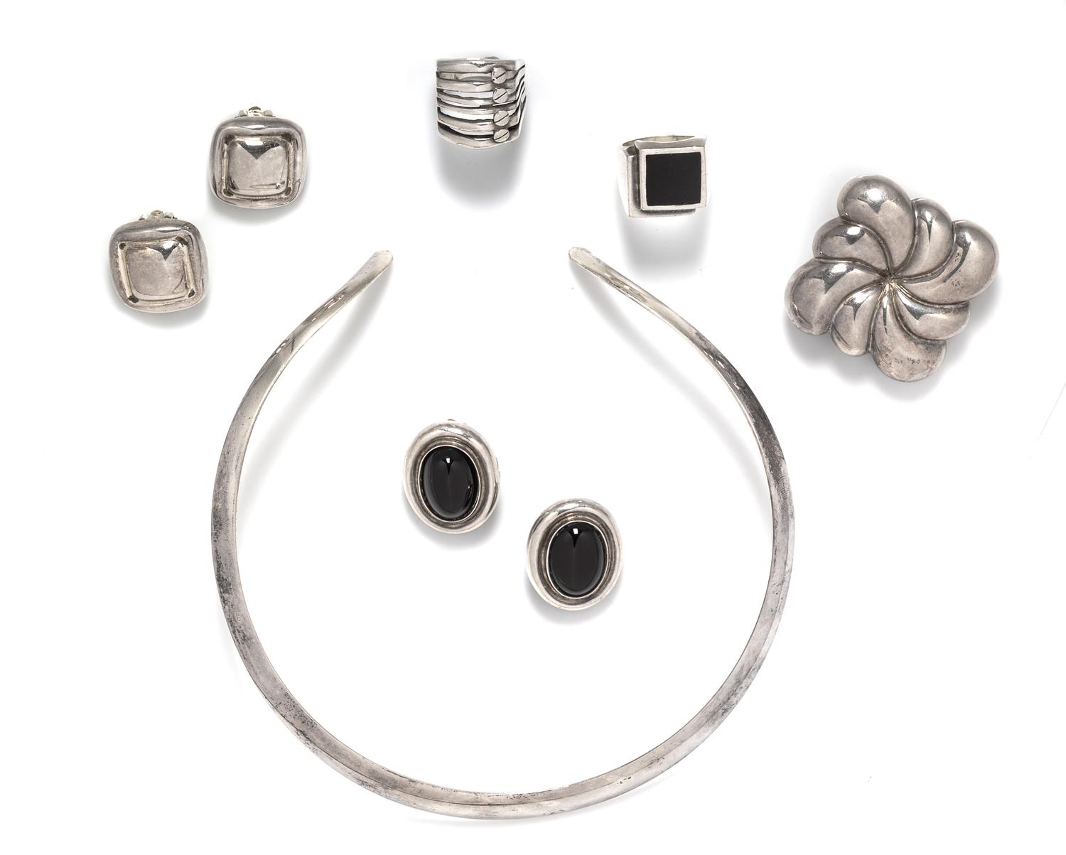 A Collection of Sterling Silver Earclips, 65.30 dwts.