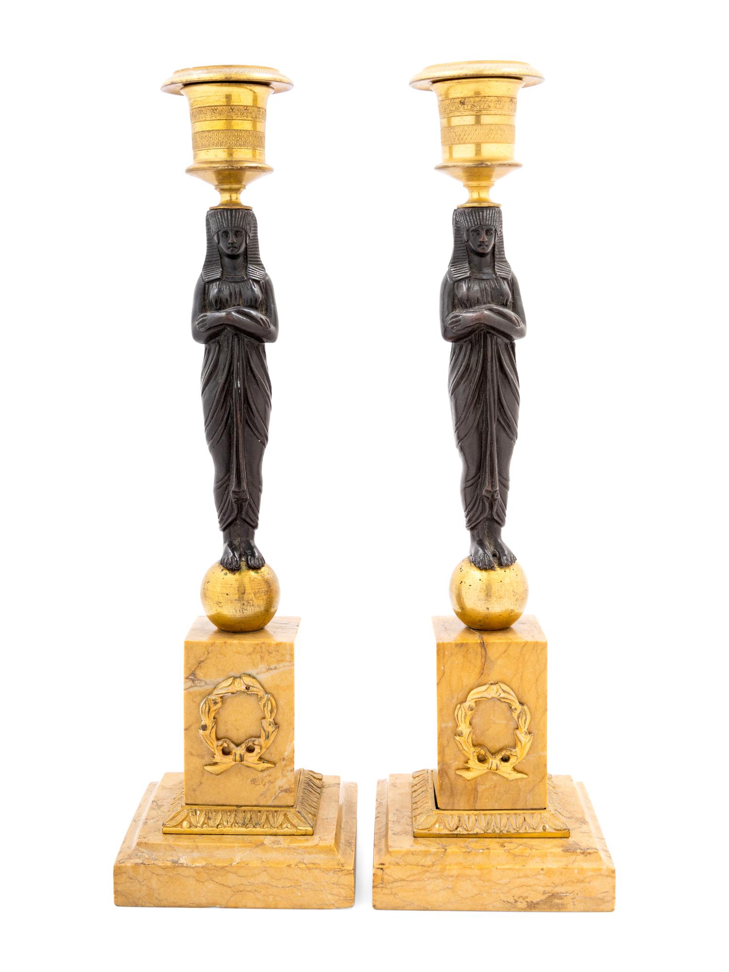 A Pair of French Egyptian Revival Bronze and Marble Candlesticks