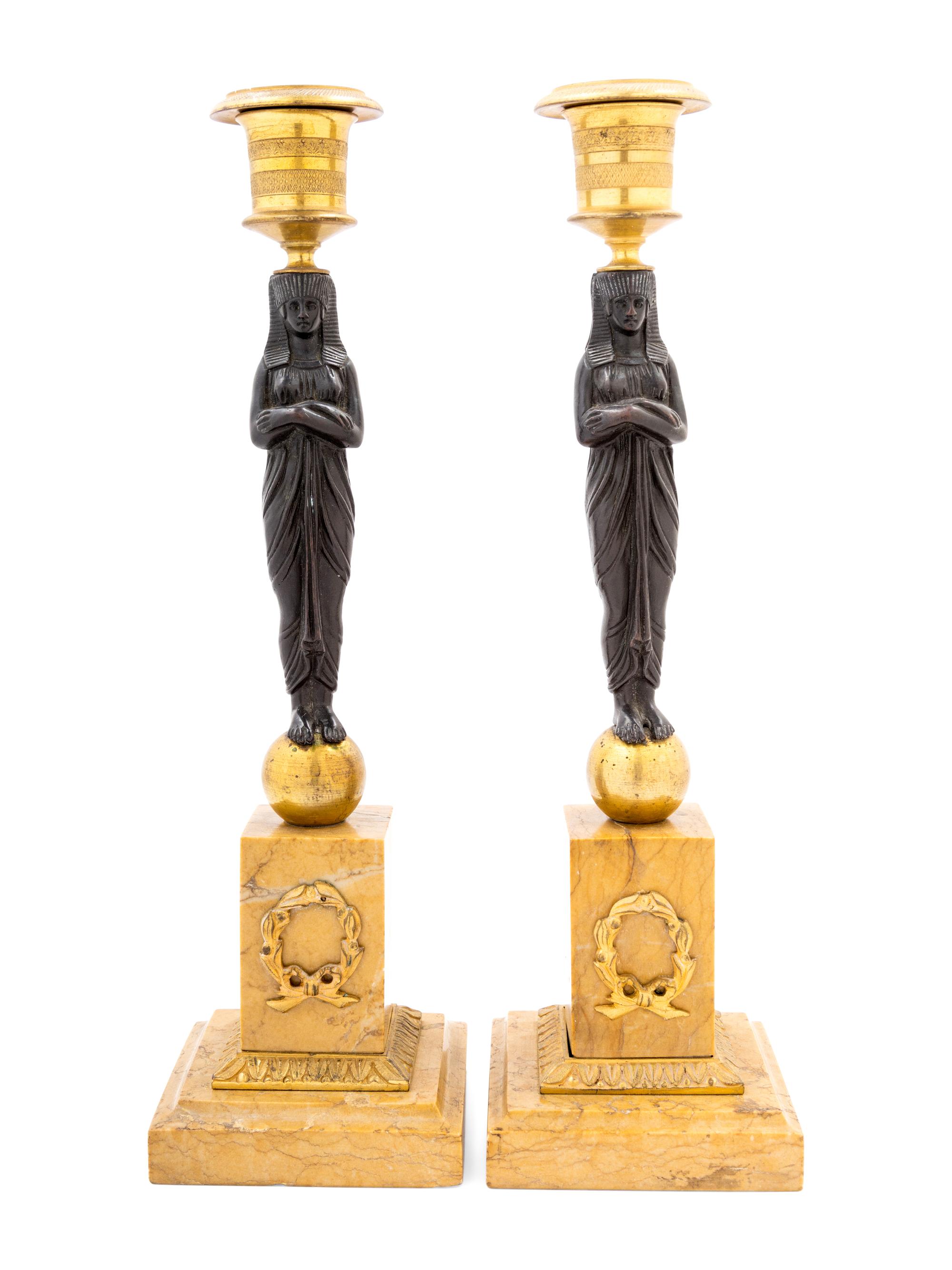 A Pair of French Egyptian Revival Bronze and Marble Candlesticks