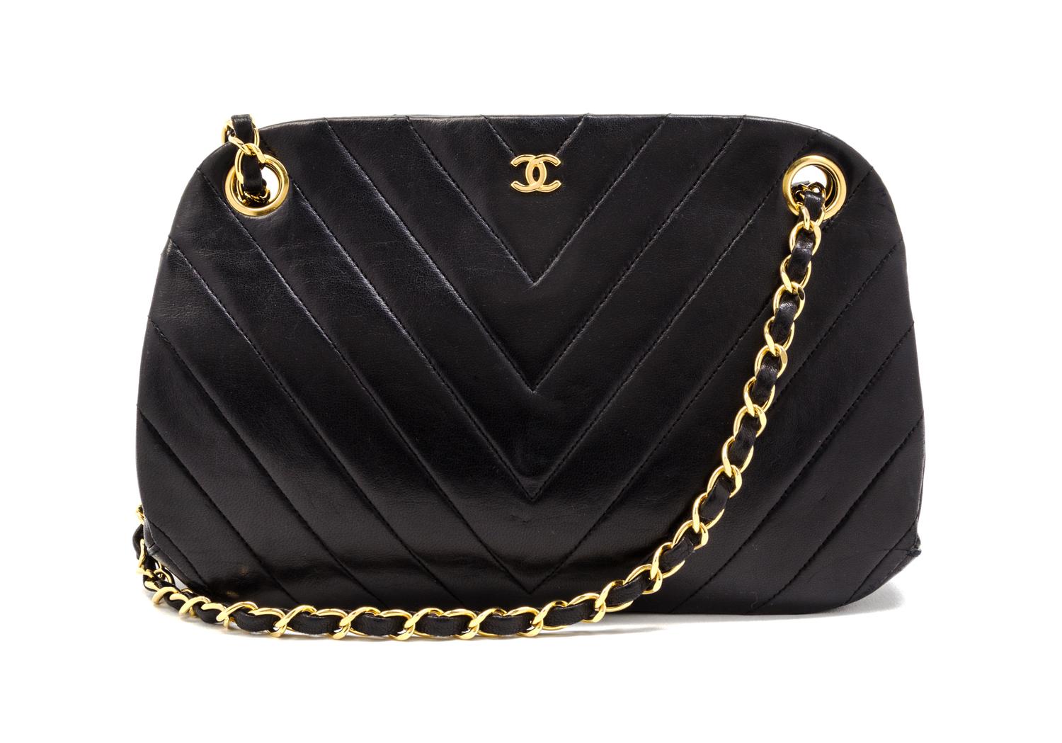 A Chanel Black Chevron Quilted Leather Bag, 10 x 5 1/2 x 3 inches.