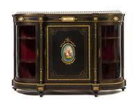 A Napoleon III Ebonized, Gilt Metal Mounted and Porcelain Inset Console Cabinet, Height 43 3/4 x width 62 1/4 x depth 17 inches.