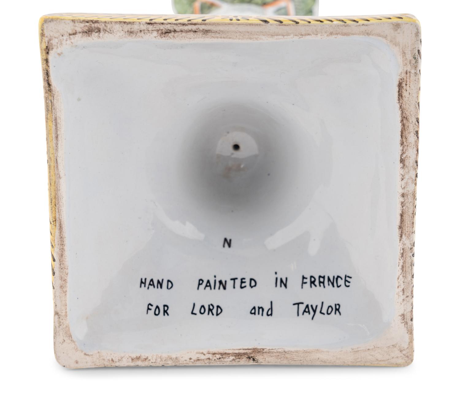A Set of Four French Faience Candlesticks