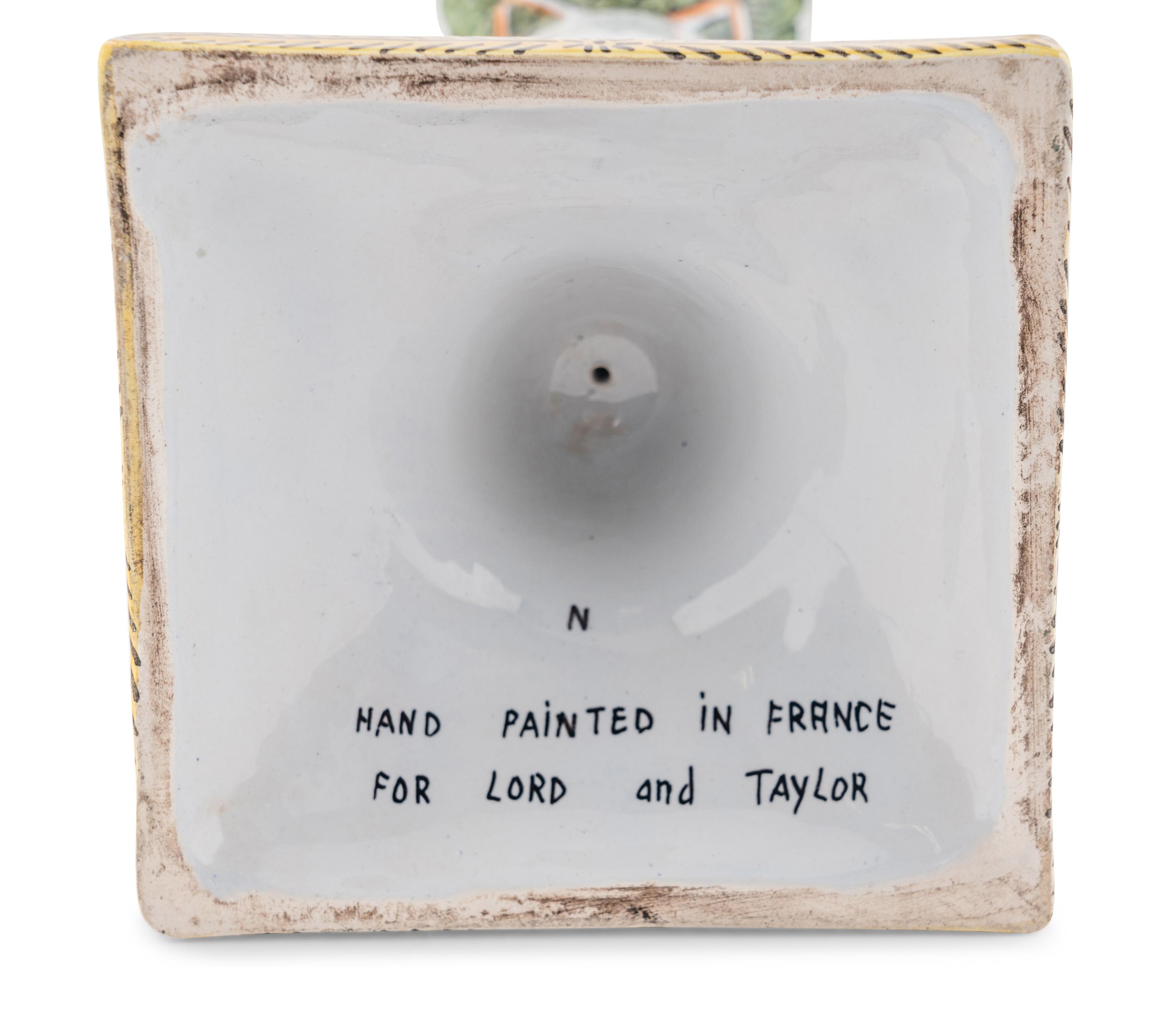 A Set of Four French Faience Candlesticks
