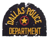 [POLITICS] -- [KENNEDY, John F. (1917-1963)]. Officer Bobby Hargis' Dallas Police shoulder patch worn during the Kennedy Assassination with inscribed photograph from Officer Hargis.
