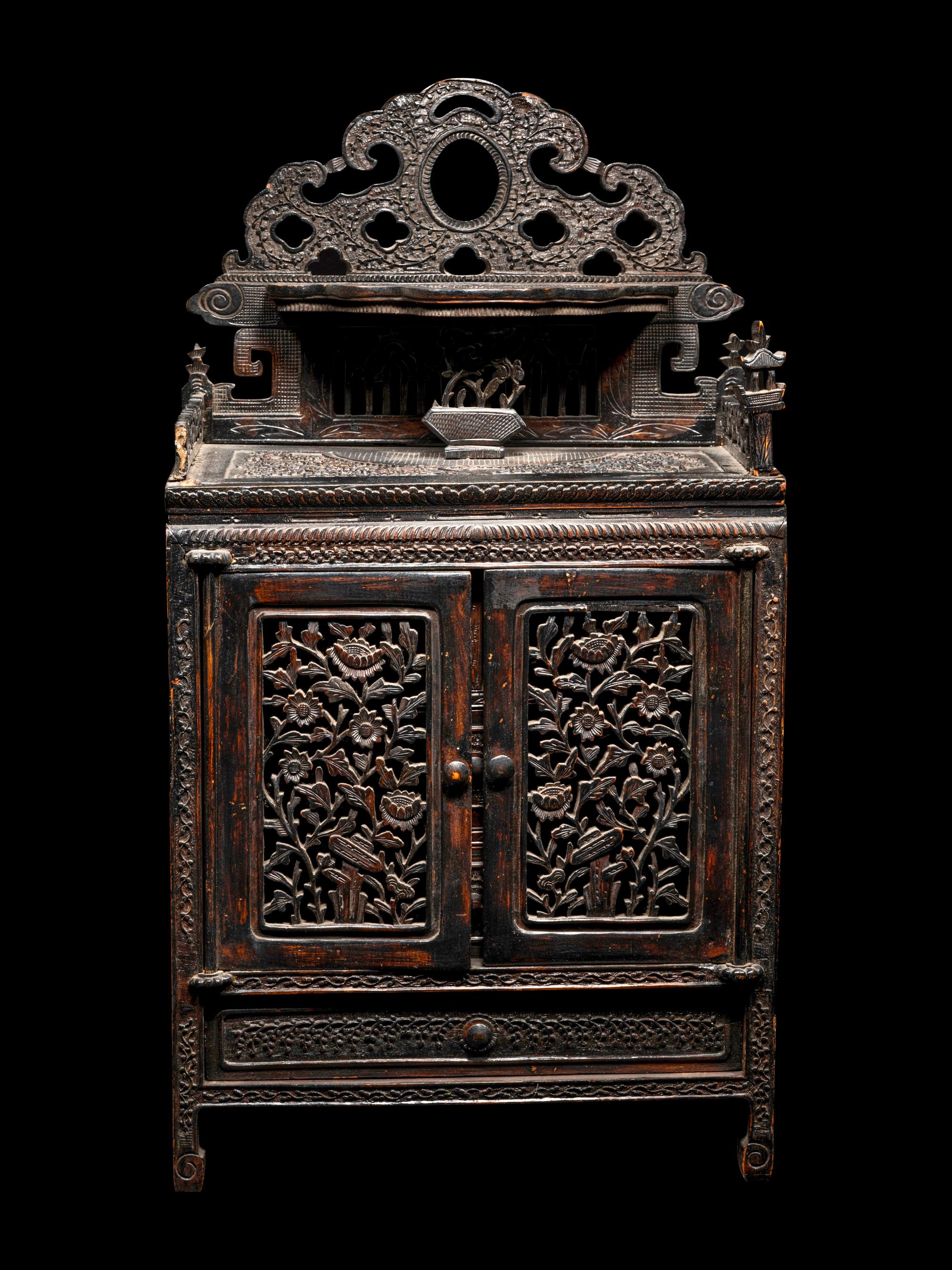A Chinese Export Carved Hardwood Cabinet