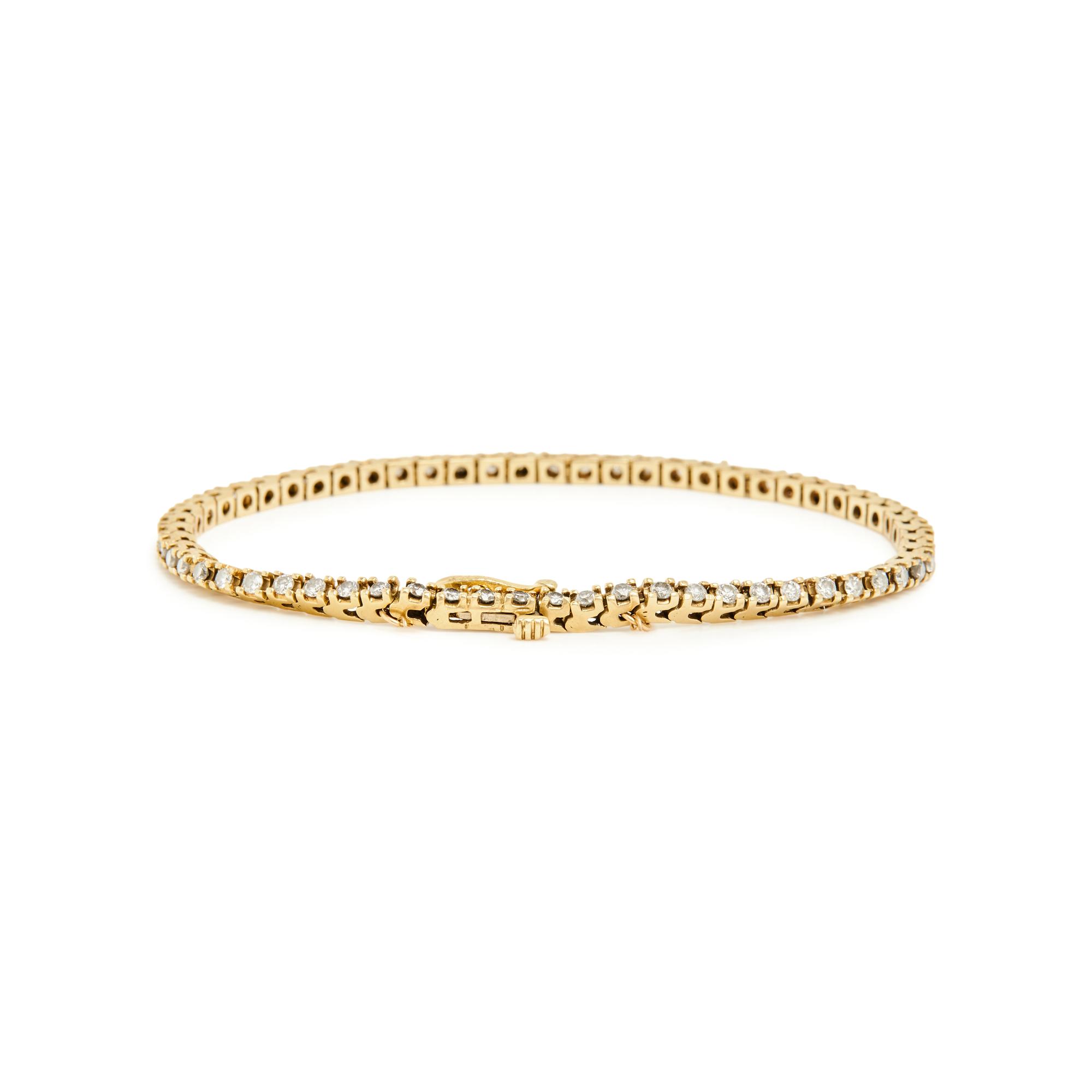 PAIR OF YELLOW GOLD AND DIAMOND LINE BRACELETS